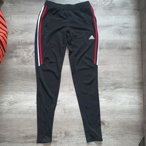 Black adidas joggers with red, white, blue stripes